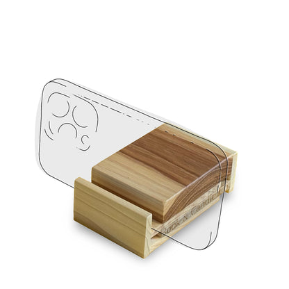 Wooden phone stand with a transparent sketch of a cell phone in place to illustrate the stand in use.